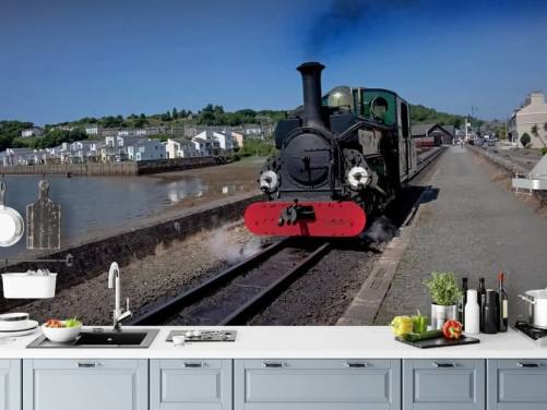 Groene stoomtrein bij de kust behang