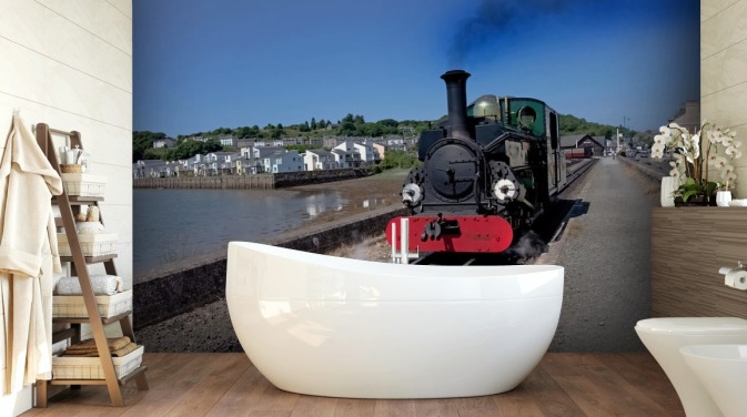 Groene stoomtrein bij de kust behang