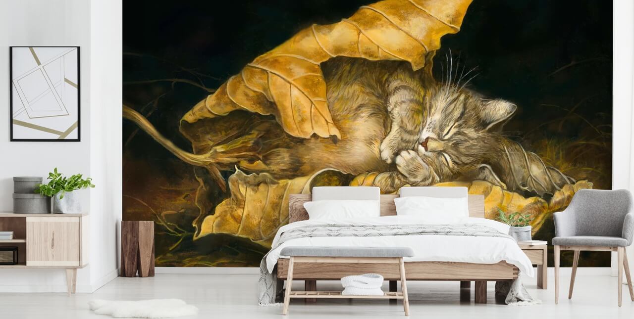 gatito dormido en hojas de otoño