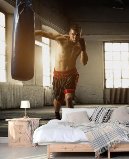 Carta da parati per giovane uomo che fa boxe in magazzino Carta da parati per giovane uomo che fa boxe in magazzino