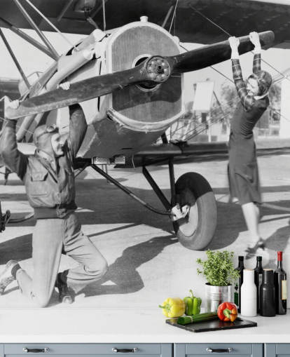 Couple Playing with a Propeller on a Plane Mural Couple Playing with a Propeller on a Plane Mural