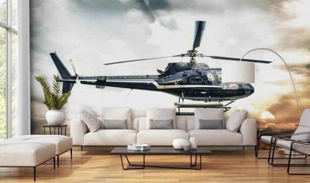 Helikopter vliegen bij zonsondergang behang