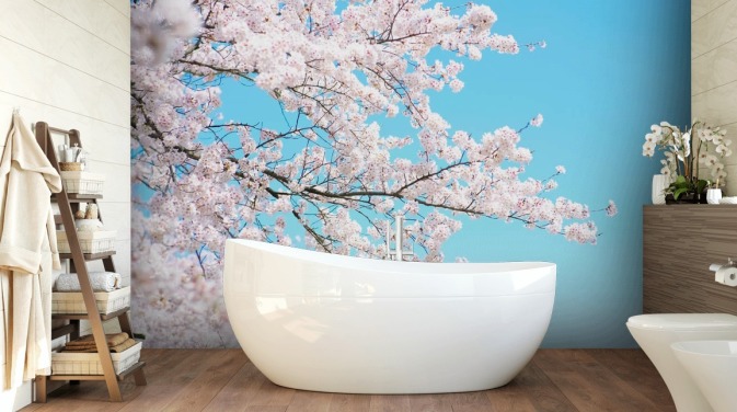 Pink Blossom tegen een felblauwe luchtmuurschildering