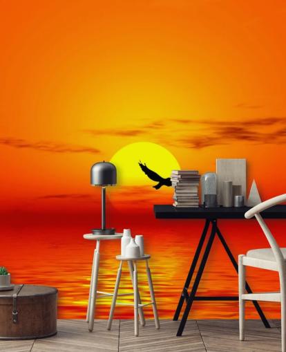 Vogel fliegt bei Sonnenuntergang über den Ozean Fototapete Vogel fliegt bei Sonnenuntergang über den Ozean Fototapete