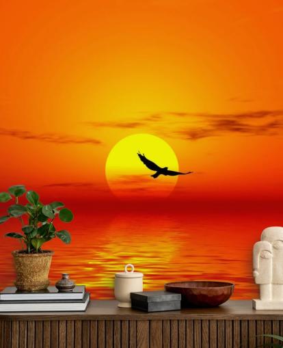 Vogel vliegen over de oceaan bij zonsondergang muurschildering Vogel vliegen over de oceaan bij zonsondergang muurschildering