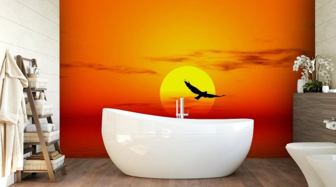 Decorazione murale con uccello che sorvola l'oceano al tramonto