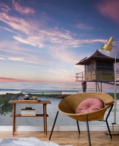 Hengenpelastajan mökki rannalla auringonlaskun seinämaalauksessa Hengenpelastajan mökki rannalla auringonlaskun seinämaalauksessa