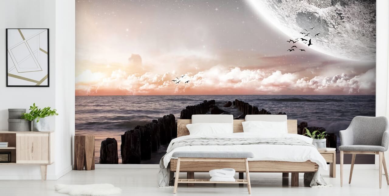 beach at night with large moon wallpaper