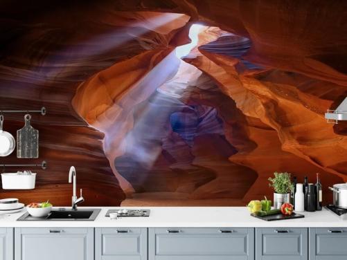 sandy cave with light filtering through wallpaper