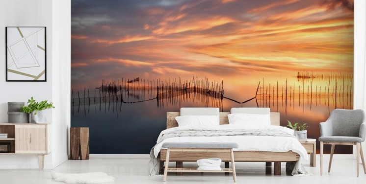 Fischnetz-Silhouetten im Meer gegen Sonnenuntergang Himmel Wallpaper