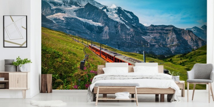 tren eléctrico rojo pasando por los alpes suizos fondo
