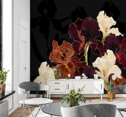 Black background with a mixture of purple, brown and white iris flowers