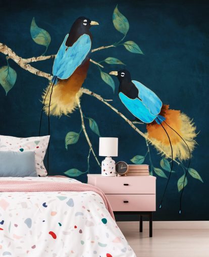 Blue and gold birds on a branch with green leaves on a dark blue background Blue and gold birds on a branch with green leaves on a dark blue background
