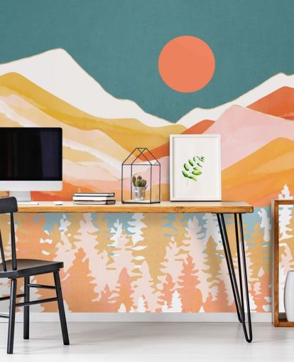 Orange and yellow mountains and forest with a teal sky and orange sun Orange and yellow mountains and forest with a teal sky and orange sun