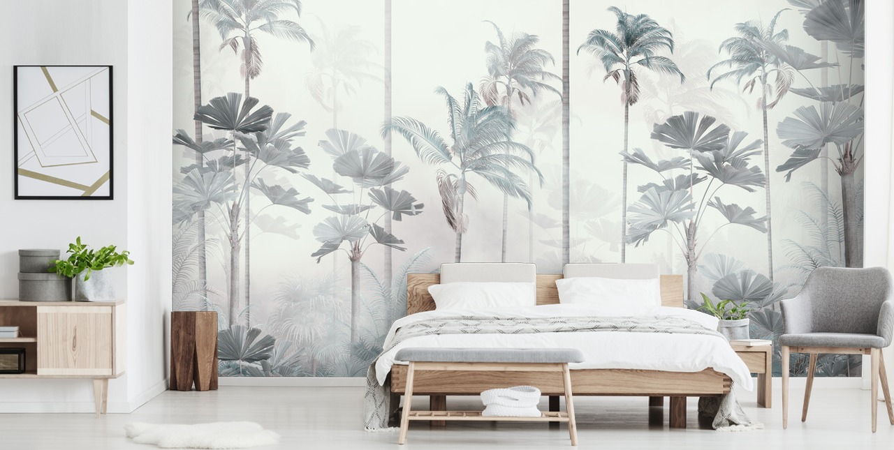White foggy background with tall muted blue and green jungle tree tops wallpaper