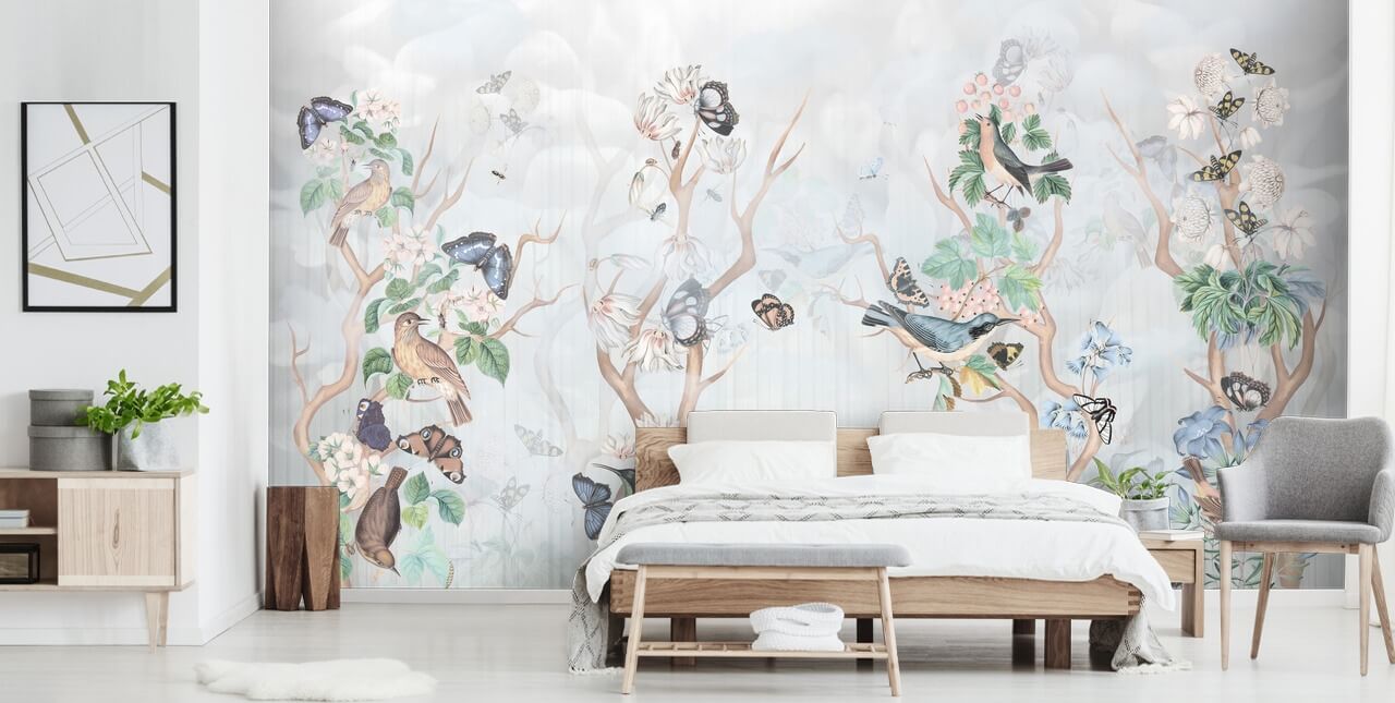 Light blue background with chinoiserie style trees with birds and butterflies