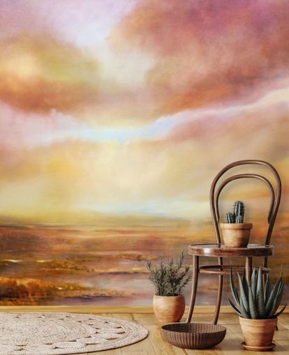 Cuadro abstracto de un paisaje amarillo y rosa con el sol brillando entre las nubes Cuadro abstracto de un paisaje amarillo y rosa con el sol brillando entre las nubes