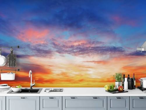 Blauwe en oranje passionate Sunset Muurschildering