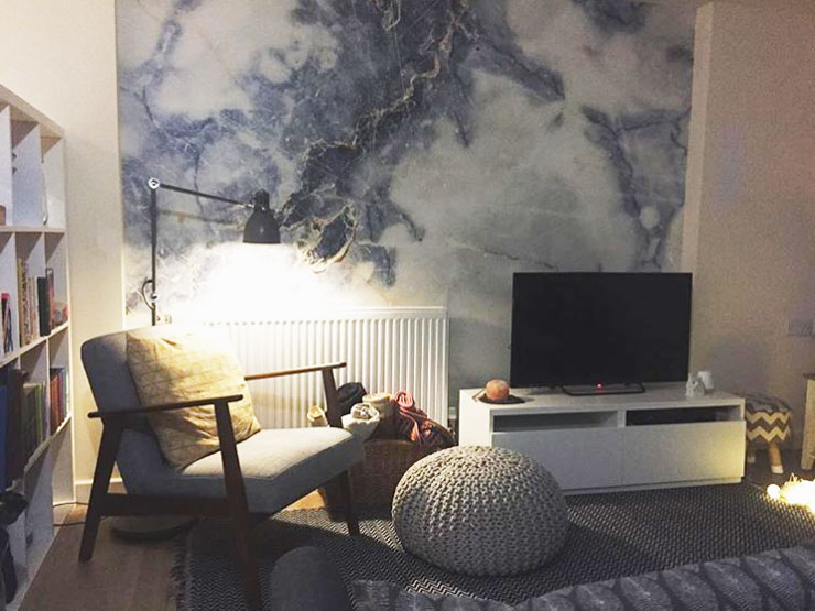 blue and white marble wallpaper in scandi living room